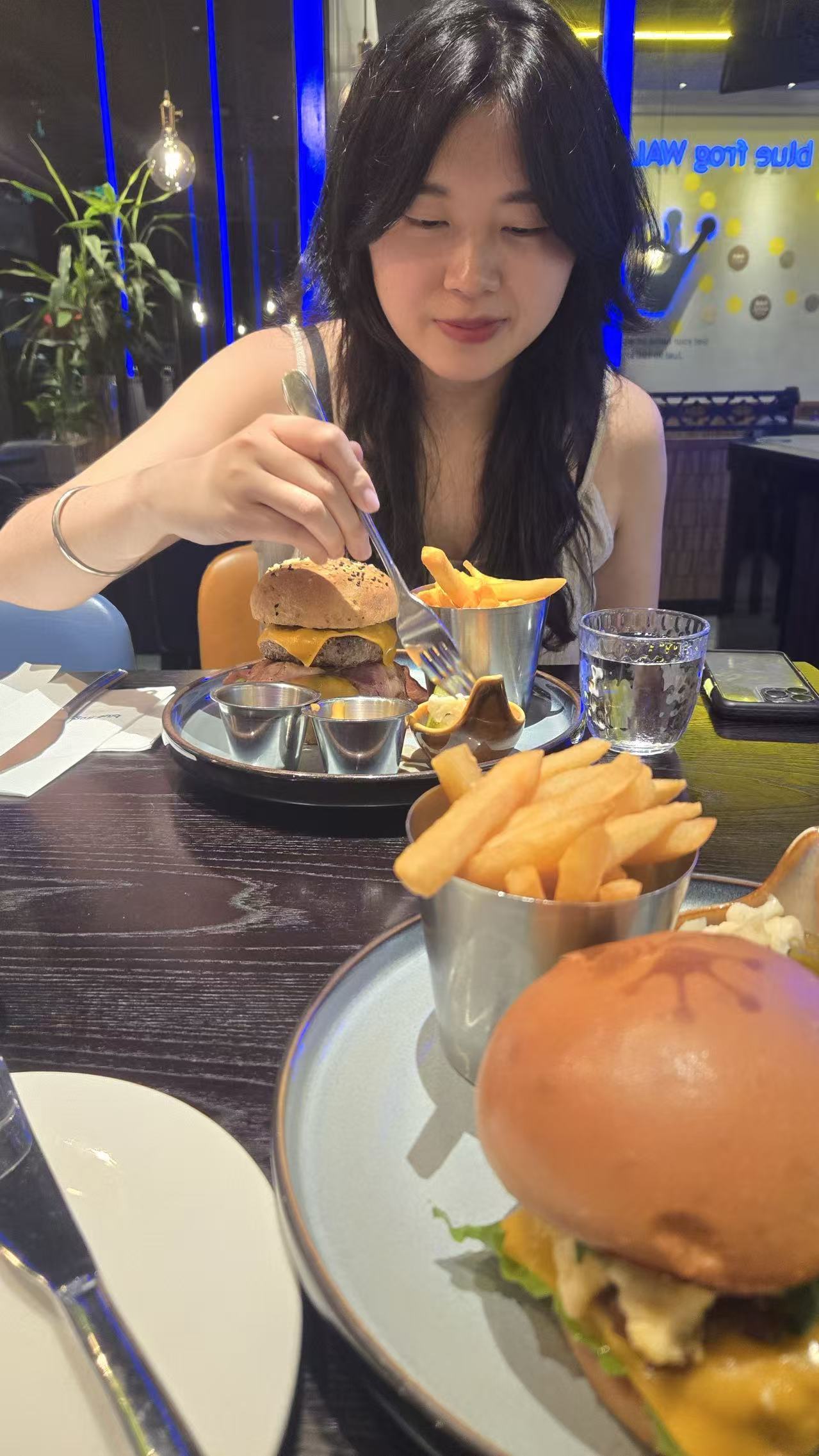 Portrait of Yifang Zhu at a restaurant